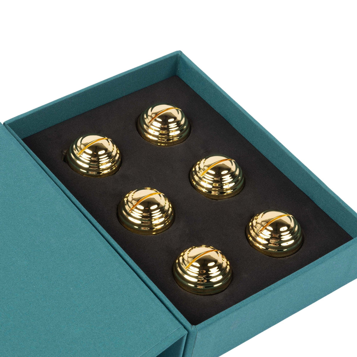 The Dear Annabelle Goldie Place Card Holder Set of 6 features dome-shaped, gold orbs in a teal box with black foam insert—an elegant, reflective touch for any table setting.