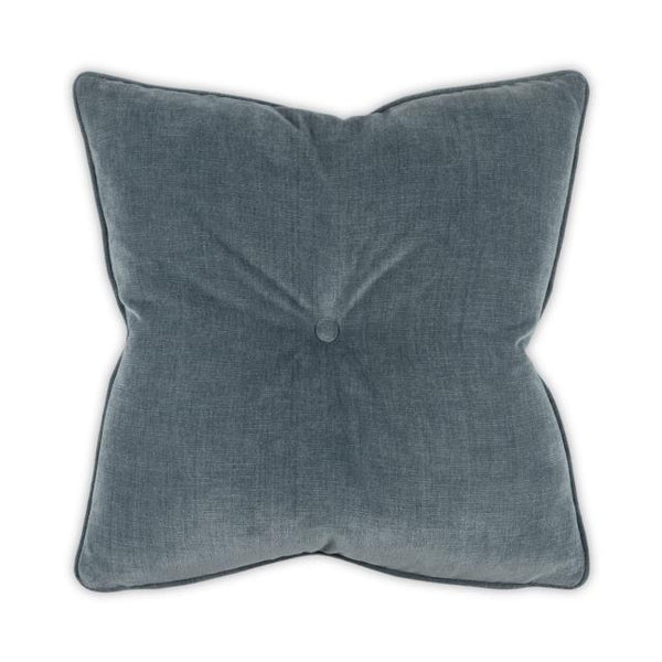 The Buttoned Bobbie Pillow - Slate Blue by Moss Studio features a square, slate blue design with textured fabric and a centered button, shown against a white background.