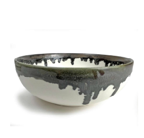 A Linea Dinnerware ceramic bowl by Michael Wainwright, featuring a white base and dark gray drip glaze on the rim, is displayed against a plain white background.