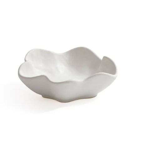 The Alto Ceramic Condiment Bowl by Zodax features an irregular wavy rim and organic shape, making it a striking, modern white ceramic piece that stands out as tableware or décor against a plain background.