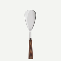 The Sabre Nature Rice Spoon features a wide, flat, rounded stainless steel blade and a brown wood handle, displayed against a plain white background.