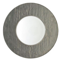 The Raynaud Makassar Metallic Charger features a wide, textured metallic gray rim and smooth white center, viewed from above against a white background, reflecting classic Makassar charger design.
