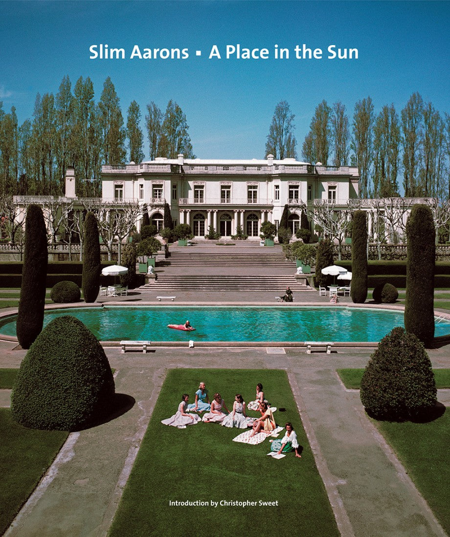 Relaxed by a pool and lush gardens, people enjoy sun-drenched leisure in Slim Aarons: A Place In The Sun—an iconic photograph, offered by Abrams /Hachette Books.