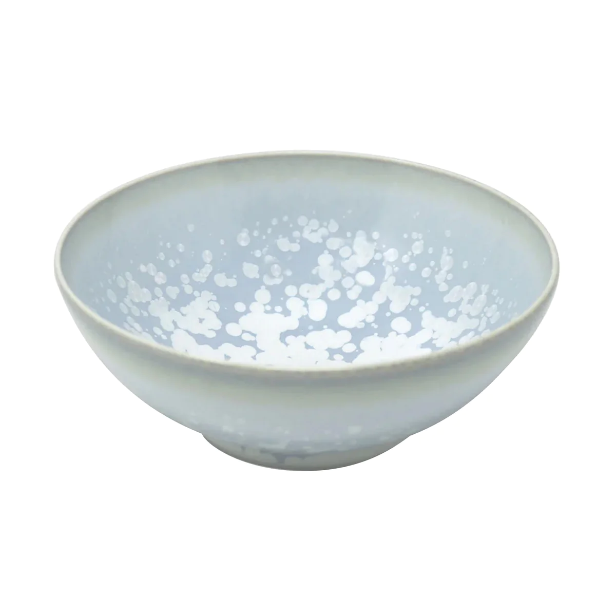 The Song Ocean Dinnerware by Jaune De Chrome is a light grey ceramic bowl with a smooth finish and white speckles on the inside, inspired by classic French dinnerware.