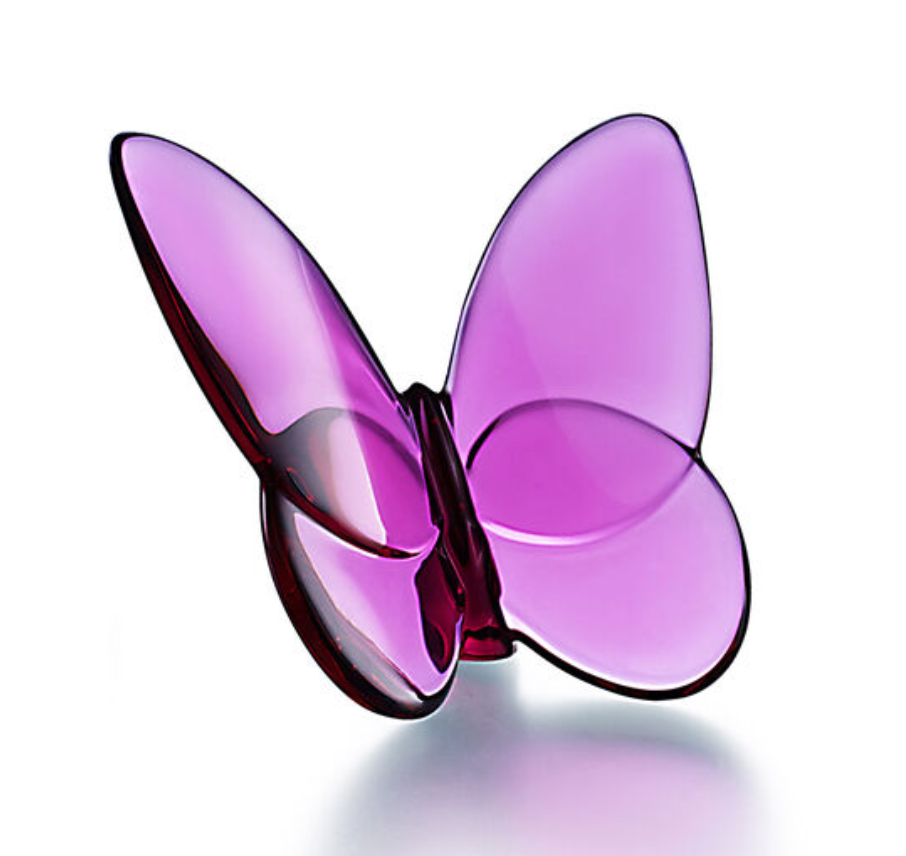 The Baccarat Papilion Lucky Butterfly is a translucent purple crystal figurine with smooth, curved wings, shown on a white background—an elegant lucky-charm gift for any occasion.