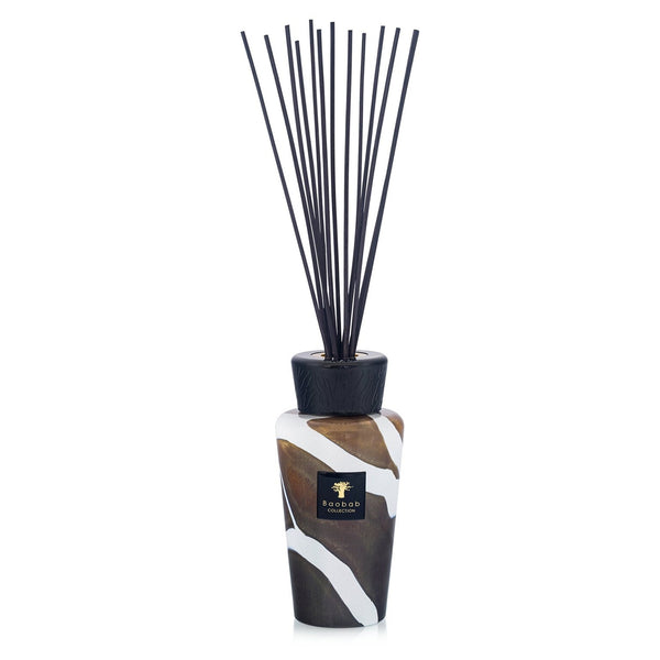 The Baobab Stones Diffuser - Agate is a decorative home fragrance diffuser, featuring a patterned brown and white Agate glass bottle, a sleek black cap, and several long black reeds standing upright.