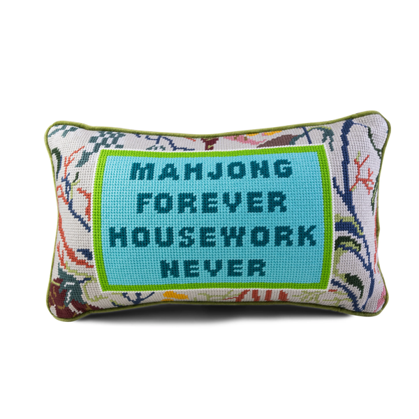 The Needlepoint Pillow - Mahjong by Furbish features floral patterns and a blue center with "MAHJONG FOREVER HOUSEWORK NEVER"—a unique decorative gift for fans of this classic game.
