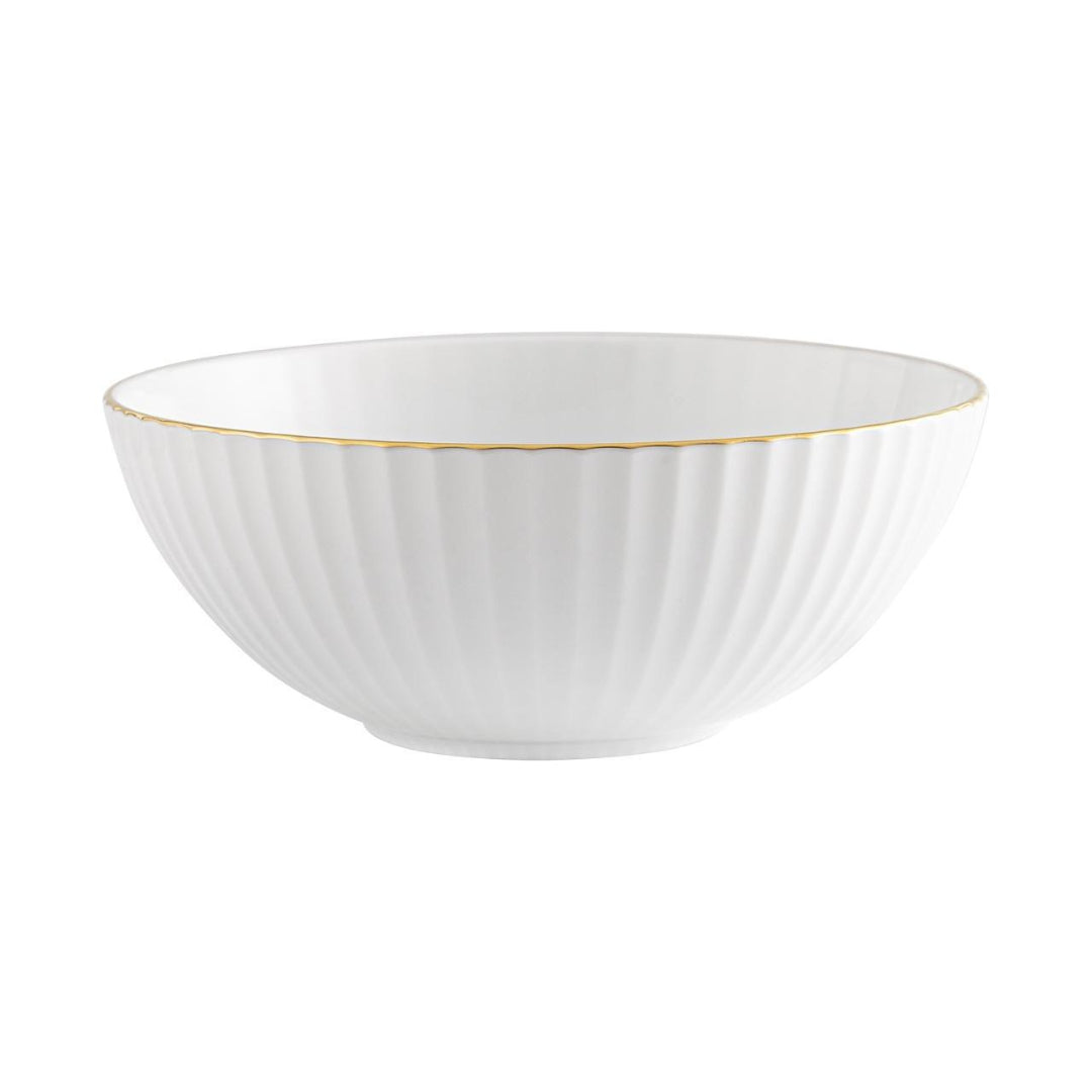 The Vista Alegre 200 Anos Dinnerware features a white porcelain bowl with vertical ridges and a hand-painted gold rim, displayed on a plain white background.