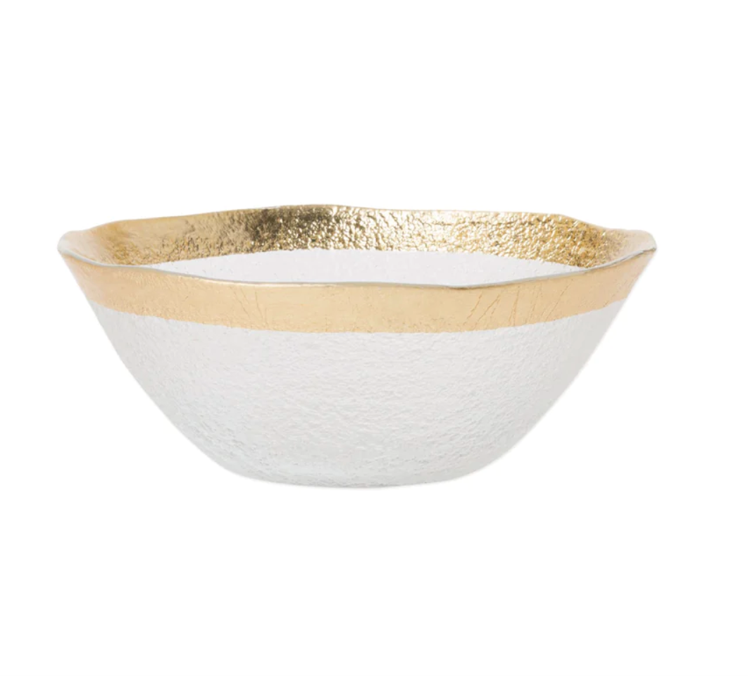 The Vietri Rufolo Glass Dinnerware Gold features clear glass with a textured surface and a wide, uneven metallic gold rim—an elegant, modern design perfect for adding glamour to your tableware collection.