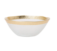 The Vietri Rufolo Glass Dinnerware Gold features clear glass with a textured surface and a wide, uneven metallic gold rim—an elegant, modern design perfect for adding glamour to your tableware collection.