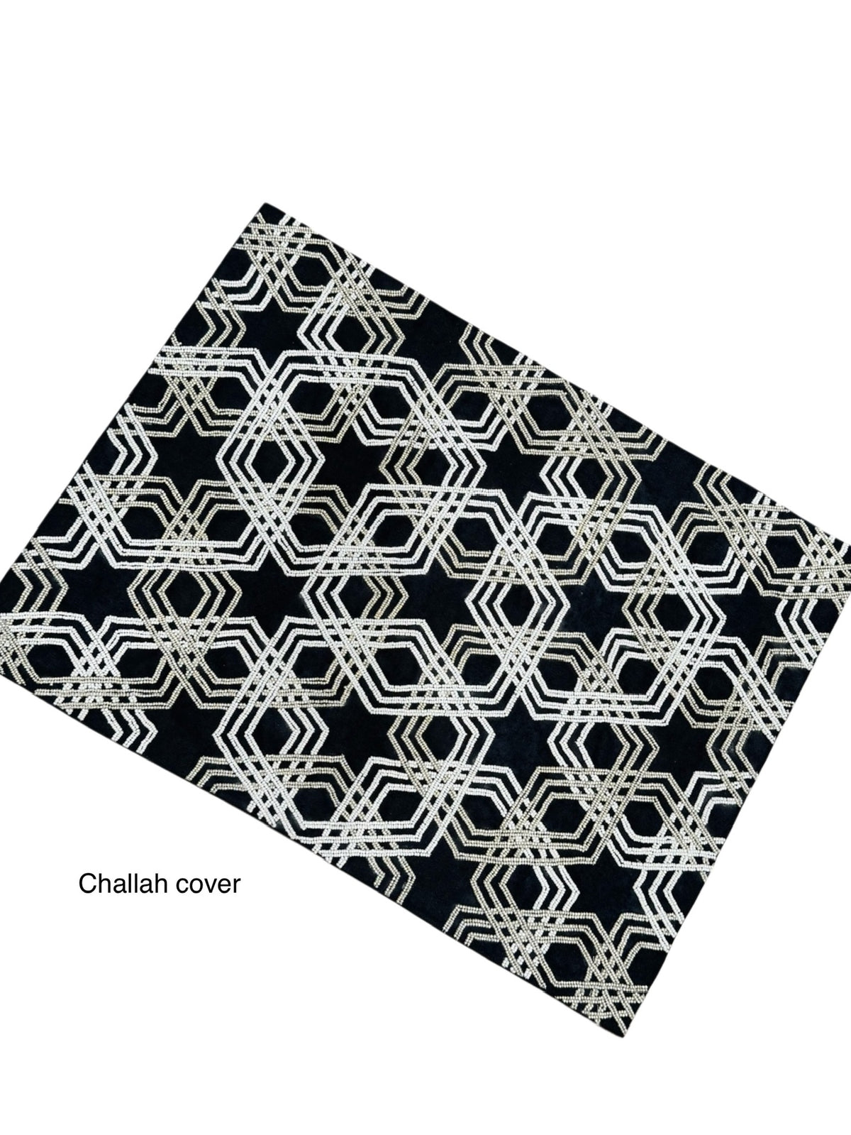 The Lyss & Kat Beaded Star of David Challah Cover features a black background with an intricate geometric white and gold pattern, subtle Star of David details, and "Challah cover" in small text at the lower left.