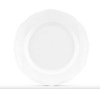 Centered against a white background, the Antico Doccia Dinnerware by Ginori 1735 features a timeless design with its plain, empty white ceramic plate and elegant scalloped edge.