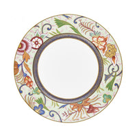The Raynaud Imari Dinnerware plate features hand-painted porcelain with a white center, a gold-outlined floral and leaf design in red, yellow, blue, and green inspired by Japanese art, and a blue geometric border near the center.