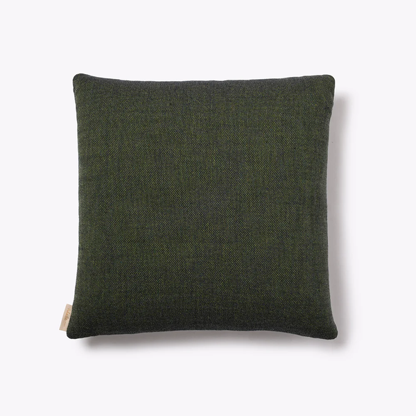 The Adaste Home Gilda Green Pillow, measuring 22x22", features a square shape, deep green color, and subtle woven texture. Displayed against a light gray background, it includes a small fabric tag on one side.