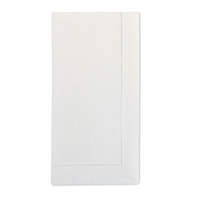 A set of four neatly folded, plain white Sferra Festival Napkins made from luxurious European linen, each featuring a subtle stitched border and displayed on a white background.