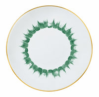 Marie Daâge Iris 1 dinner plate in white Limoges porcelain featuring a green brushstroke pattern in a circular motif and a gold rim.