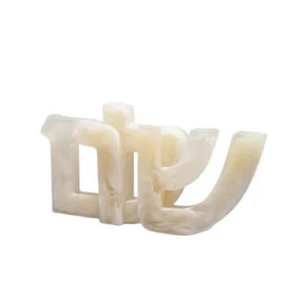 A translucent, cream-colored Shalom Sculpture - Alabaster in the shape of the Hebrew letters for Shalom.