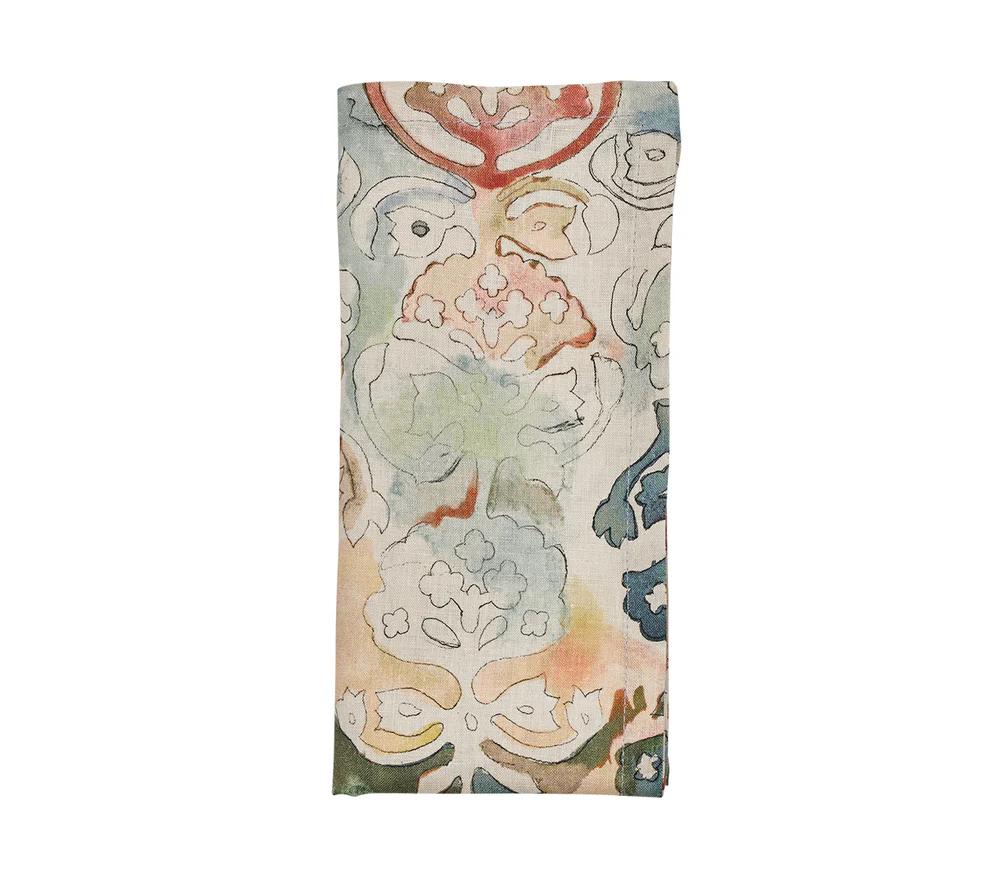 The Kim Seybert Giverny Napkin Set of 4 features folded linen napkins with an abstract floral pattern in soft blue, green, red, and beige tones—ideal for Monet-inspired decor—shown against a white background.