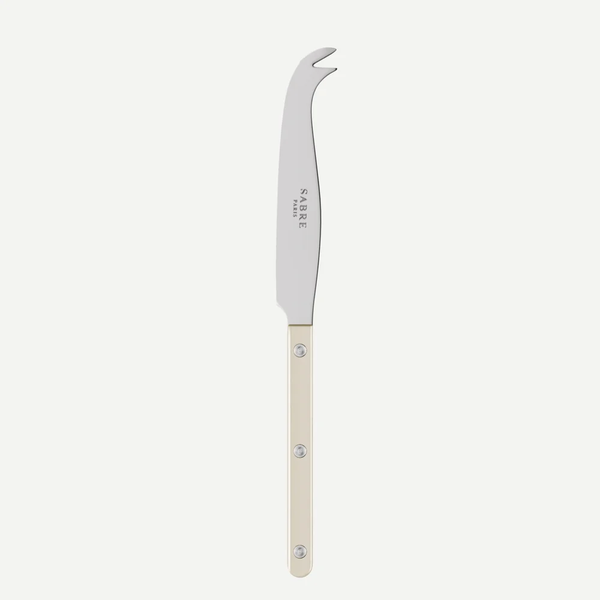 The Sabre Bistrot Pearly Cheese Knife features a stainless steel blade with a curved, forked tip and a pearly, light-colored handle adorned with three rivets. Displayed against a plain white background, it’s an ideal choice for anyone seeking customizable flatware to enhance any table setting.