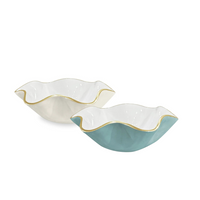 The Beatriz Ball Encanto Carola Bowls (small) feature wavy edges, gold trim, and come in cream and teal.
