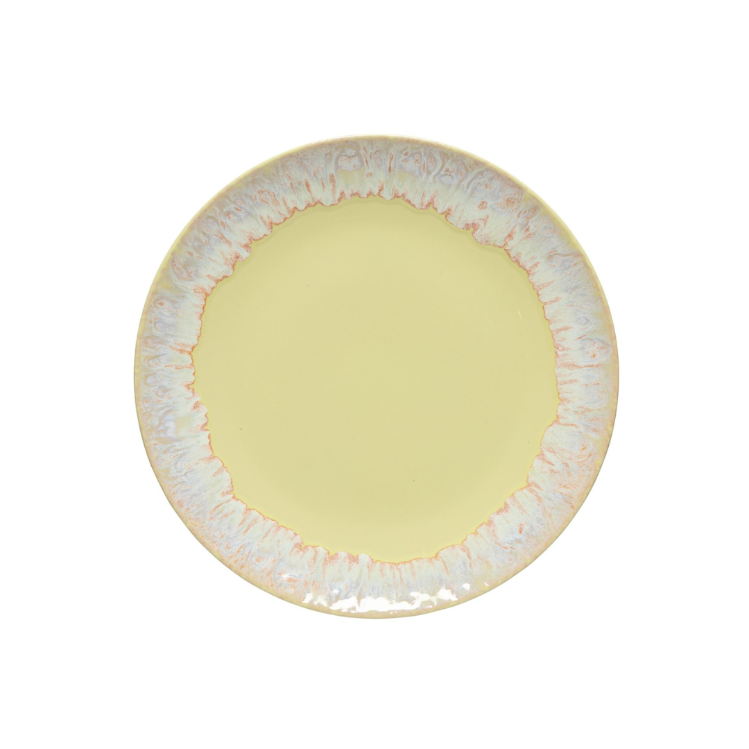 The Costa Nova Taormina Dinnerware Yellow plate features a soft yellow center and a white and pale pink marbled rim, crafted from artisanal stoneware. Seen from above, this round ceramic piece is showcased on a white background.