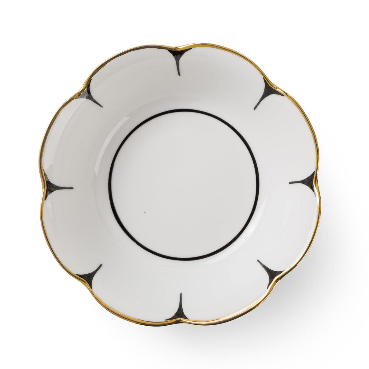 The Drops Dinnerware saucer by Molecot features white Limoges porcelain, scalloped flower-shaped edges, black accent lines radiating from each edge, and a gold-finished trim along the rim.