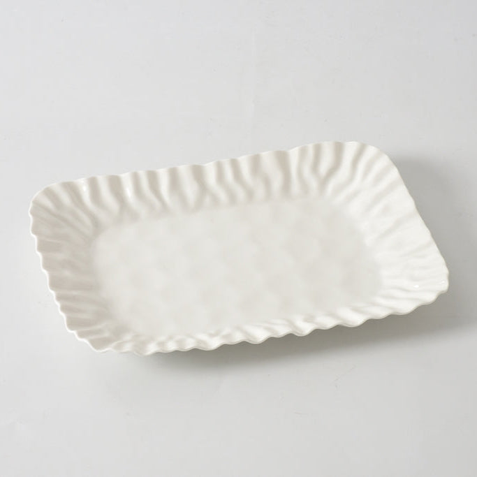 The PAMPA BAY Mascali Bianca Deep Tray is a rectangular white porcelain serving tray featuring wavy, textured edges, shown against a plain white background.