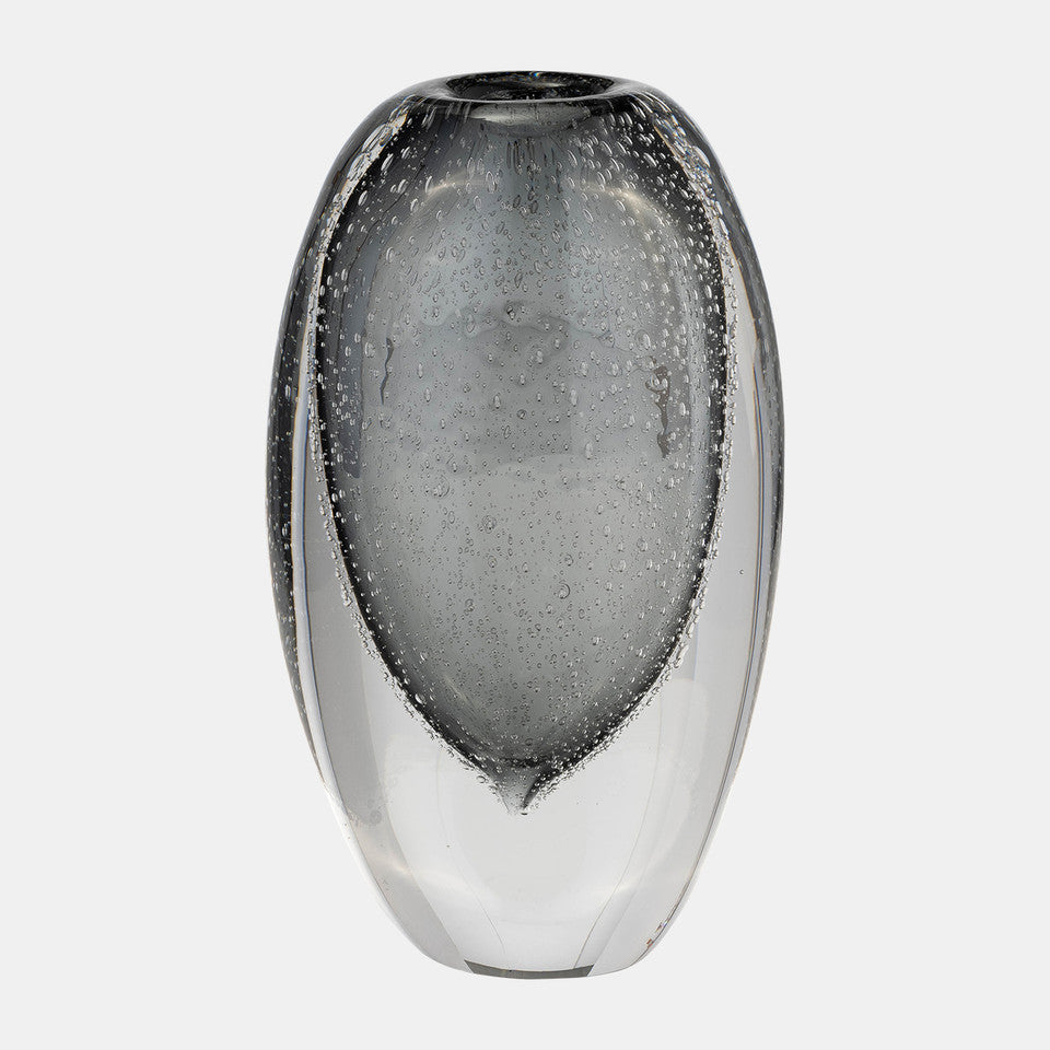 The Sagebrook Home Orbit Vase Smoke is an oval glass vase with a thick base and subtle bubbles in the glass, shown against a plain white background.