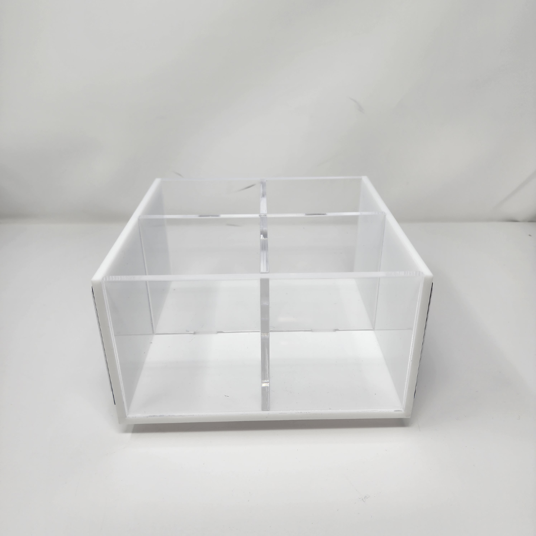 The Eye Candy College Spinner is a clear acrylic box with four equal compartments, perfect for organizing your college desk. Shown here against a plain white background.