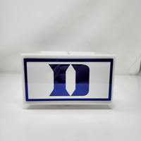 A white rectangular Eye Candy College Spinner box with a bold blue "D" logo on the front is displayed as a sleek college desk organizer against a plain white background.