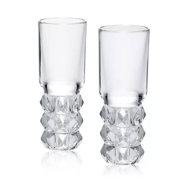The Louxor Vodka Set of 2 by Baccarat features clear glass tumblers with smooth rims and diamond-cut crystal bases, displayed side by side on a white background.