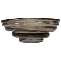The Kavana Cameron Art Glass Bowl features a round, smoky gray design with a thick, layered rim and slightly elevated base—ideal as a modern decorative centerpiece—shown against a white background.