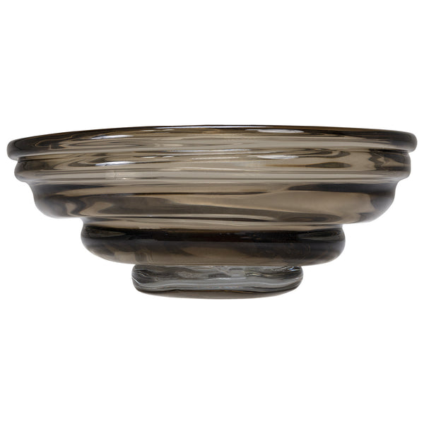 The Kavana Cameron Art Glass Bowl features a round, smoky gray design with a thick, layered rim and slightly elevated base—ideal as a modern decorative centerpiece—shown against a white background.