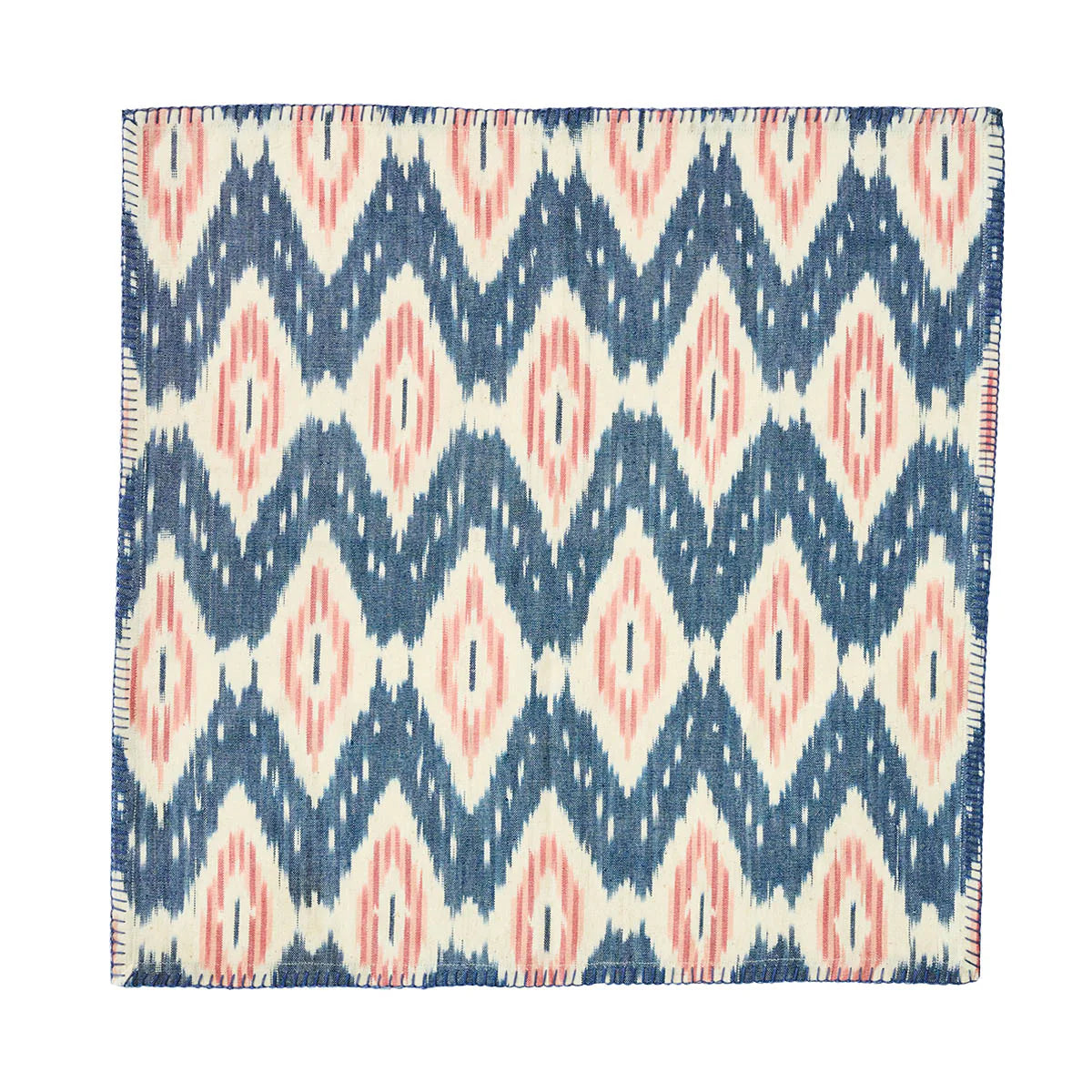 The Ikat Napkin - Set/4 by Juliska features a geometric blue, white, and blush pattern with diamonds and zigzags—perfect for bringing an island-inspired touch to your table.