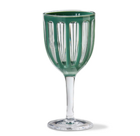 The Chalet Acrylic Drinkware Green by TAG features a clear wine glass with vertical green panels around the bowl, a long stem, and a round base.