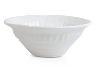 A white ceramic bowl with a fluted rim and glossy finish from the Pietra Serena collection by Vietri, shown against a plain white background.