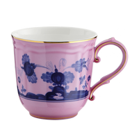 The Oriente Italiano Dinnerware Azalea teacup by Ginori 1735 features a pink and white base, dark blue chinoiserie floral motif, gold rim, and ornate handle with gold accents. Shown on a plain white background.