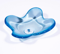 The Cloud Dish by Tyler Barry Design is a hand-blown glass bowl in translucent blue with wavy, uneven edges and a smooth, glossy finish, shown elegantly on a white background.