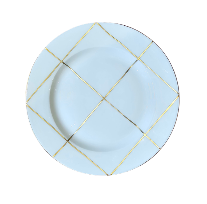 A Marie Daâge Trame Blanc white porcelain plate featuring a decorative gold grid pattern along the rim, set against a plain white background.