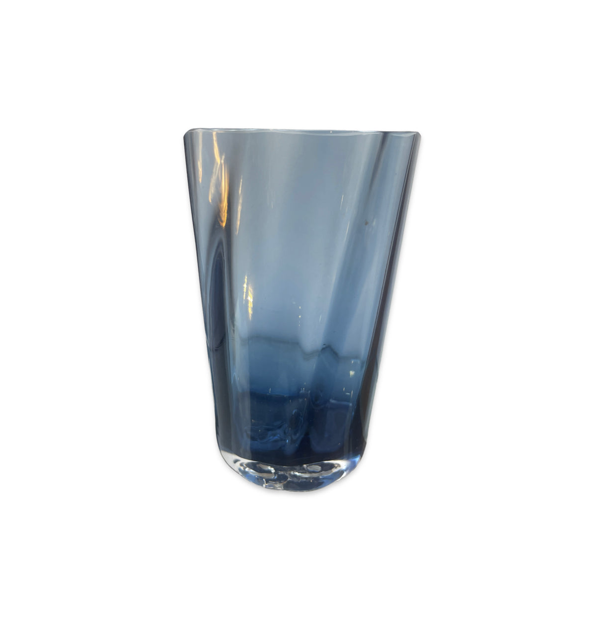 The Optic Cups - Midnight - by Gary Bodker are handcrafted glassware with a gradient blue tint, featuring a clear design that widens at the top and tapers at the bottom, shown on a plain white background.