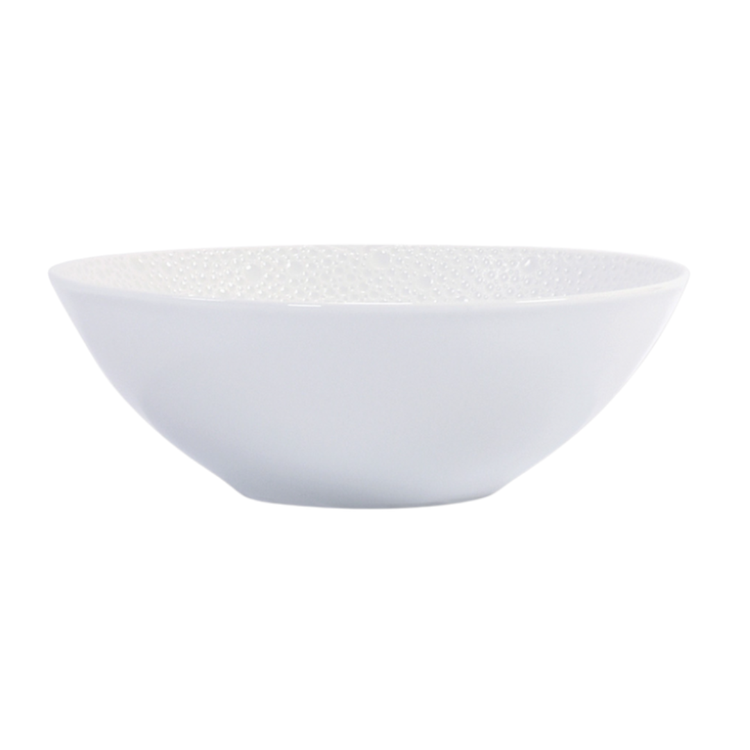 The Ecume White Dinnerware bowl by Bernardaud features plain white Limoges porcelain with a subtly textured interior and simple, round shape—an elegant piece shown against a white background.