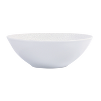The Ecume White Dinnerware bowl by Bernardaud features plain white Limoges porcelain with a subtly textured interior and simple, round shape—an elegant piece shown against a white background.
