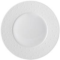 The Ecume White Dinnerware by Bernardaud is a round porcelain plate featuring a smooth center and a dotted, textured rim, shown from above against a plain white background.