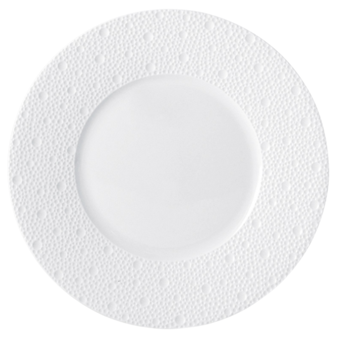 The Ecume White Dinnerware plate by Bernardaud is a round Limoges porcelain plate with a wide, textured rim and subtle dotted pattern, shown from above on a white background.