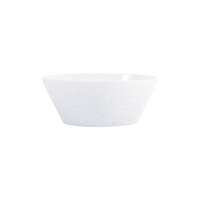 The Bernardaud Ecume White Dinnerware features a small, white, textured ceramic bowl with a subtle dotted pattern, crafted from fine Limoges porcelain and displayed on a plain white background.