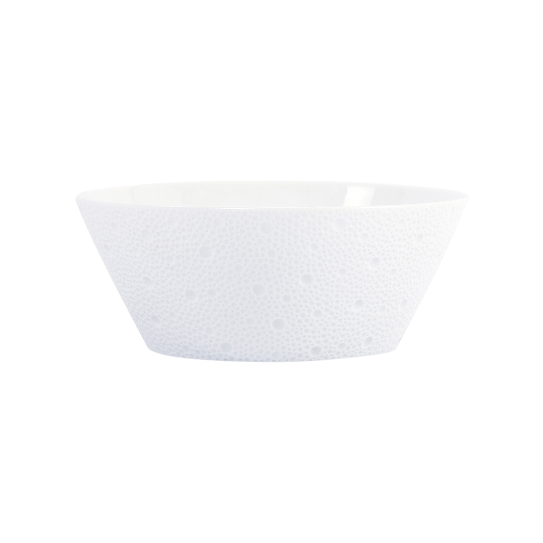 The Bernardaud Ecume White Dinnerware features a white Limoges porcelain bowl adorned with a subtle raised dot texture, beautifully photographed against a plain white background.