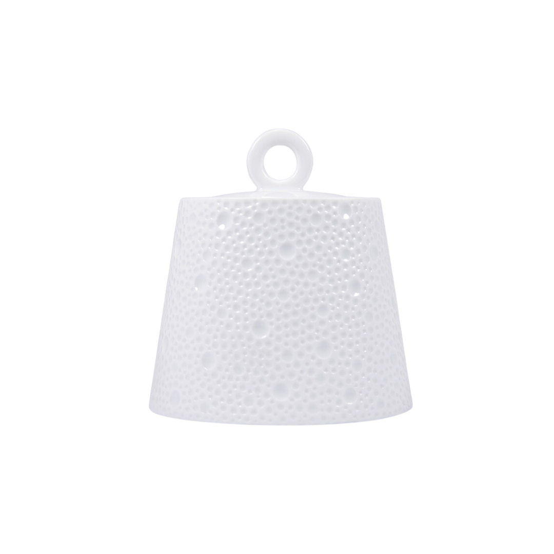 The Ecume White Dinnerware by Bernardaud is a textured, bell-shaped Limoges porcelain piece with a circular loop on top, photographed against a plain white background.