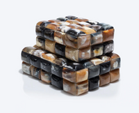 Two stacked Bubble Horn Boxes by A Sanoma Inc, crafted from glossy multicolored horn tiles in brown, black, cream, and gray. Each box's woven pattern adds a unique touch to whimsical decor against a plain white background.