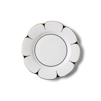 The Molecot Drops Dinnerware plate, featuring a white round Limoges porcelain body with a scalloped edge, black outline accents, and gold-trimmed border, is displayed on a white background.