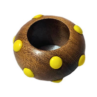 The Candy Dots Napkin Ring Set of 4 by Von Gern Home features round, brown wooden rings with evenly spaced yellow dots—a playful way to brighten your table and add color to your napkin ring collection.